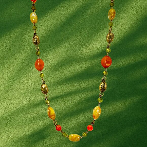 Multi color bead necklace with a mix of beige, green, and deep orange tones. - Picture 11 of 11